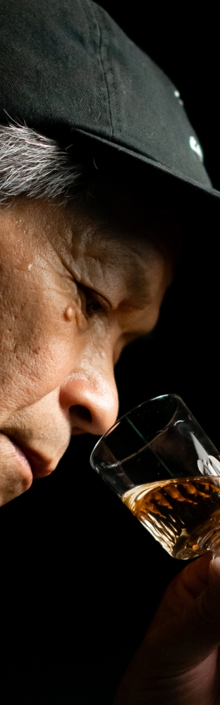Man nosing a glass of whisky